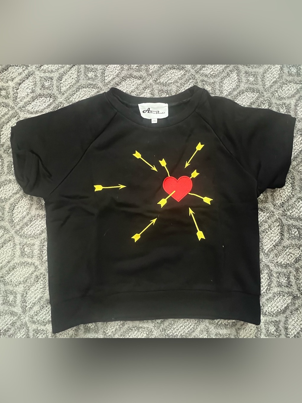 Astro Bettie Black Short-Sleeve knit with Red Heart and Yellow Arrow Graphic